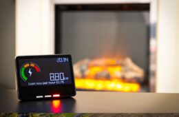 A person checking on energy usage on a home smart meter. A technology use concept.